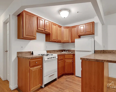 242 W 21st Street - Photo Thumbnail 1