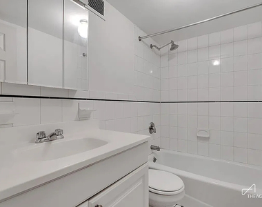 242 W 21st Street - Photo Thumbnail 4