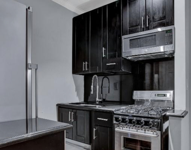E 26TH ST - Photo Thumbnail 2