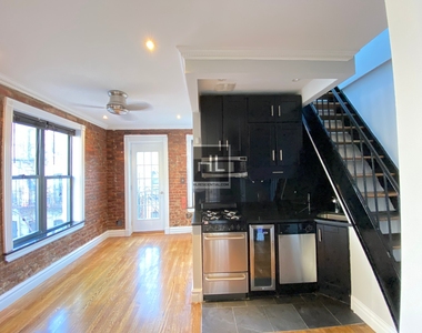 E 13th St. - Photo Thumbnail 1