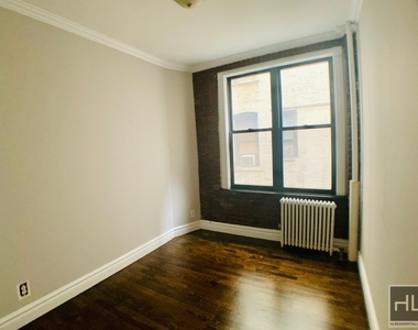 E 13th St. - Photo Thumbnail 3