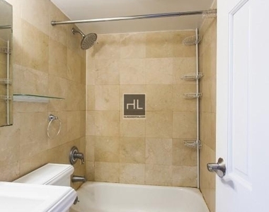 E 13th St. - Photo Thumbnail 3