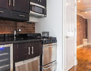 E 6th St. - Photo Thumbnail 2
