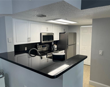 5051 Wiles Road - Photo Thumbnail 4
