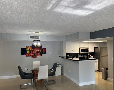 5051 Wiles Road - Photo Thumbnail 2