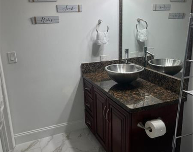 5051 Wiles Road - Photo Thumbnail 7