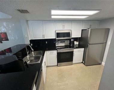 5051 Wiles Road - Photo Thumbnail 5