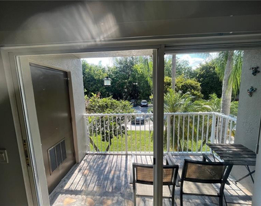 5051 Wiles Road - Photo Thumbnail 3