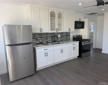 1550 1/2 W 59th Place - Photo Thumbnail 1