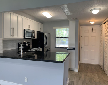 10011 Winding Lake Road - Photo Thumbnail 1