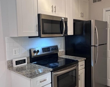 1601 Spring Gate Drive - Photo Thumbnail 4