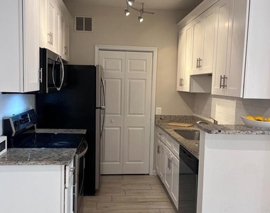 1601 Spring Gate Drive - Photo Thumbnail 2