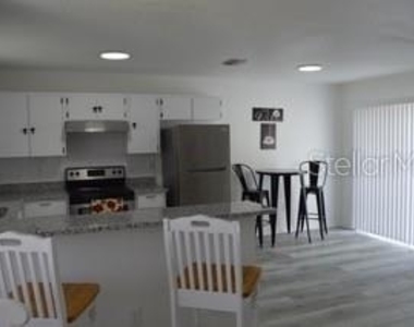 6516 E 25th Avenue - Photo Thumbnail 3
