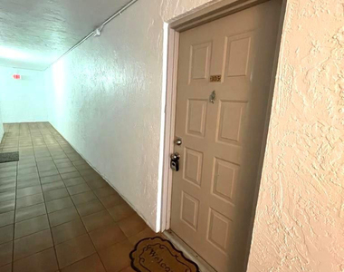 711 N Pine Island Road - Photo Thumbnail 2