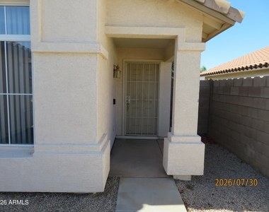 15446 W Gelding Drive - Photo Thumbnail 3