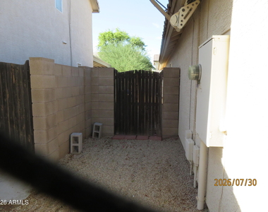 15446 W Gelding Drive - Photo Thumbnail 4