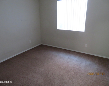 15446 W Gelding Drive - Photo Thumbnail 8