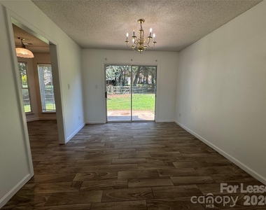 4412 David Cox Road - Photo Thumbnail 2