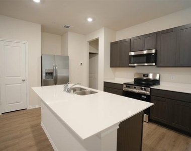7005 Cottonseed Drive - Photo Thumbnail 1