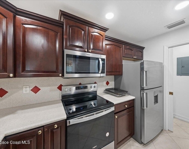 7667 N Wickham Road - Photo Thumbnail 5