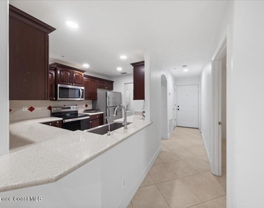 7667 N Wickham Road - Photo Thumbnail 6