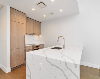 E 23rd St - Photo Thumbnail 3