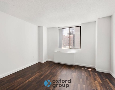 E 33rd St. - Photo Thumbnail 3