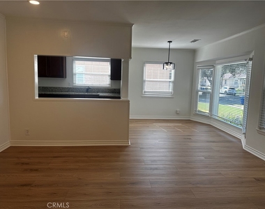 6108 Village Road - Photo Thumbnail 2