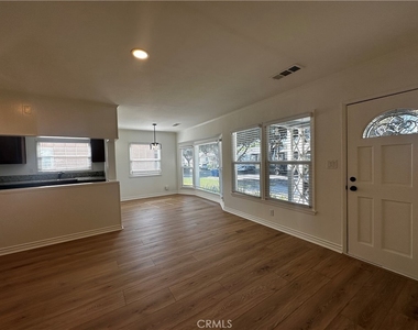 6108 Village Road - Photo Thumbnail 1