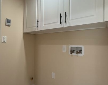 9011 Holmes Avenue - Photo Thumbnail 5