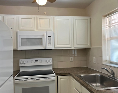 9851 Sandalfoot Boulevard - Photo Thumbnail 3