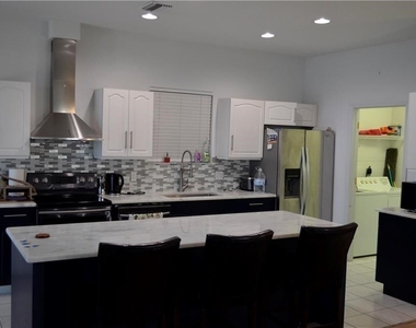 1702 Emerald Cove Drive - Photo Thumbnail 1