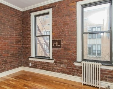 E 13th St. - Photo Thumbnail 5