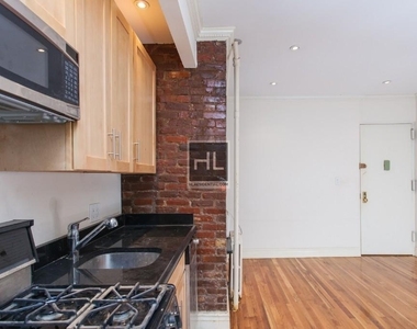 E 13th St. - Photo Thumbnail 1