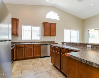 14653 W Gelding Drive - Photo Thumbnail 4