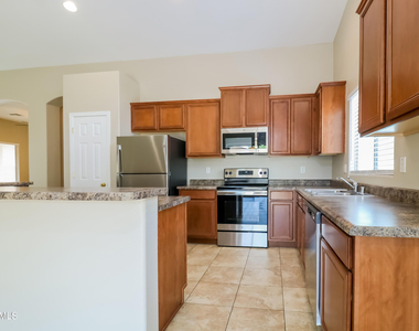 14653 W Gelding Drive - Photo Thumbnail 3