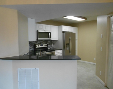 8977 Wiles Road - Photo Thumbnail 3