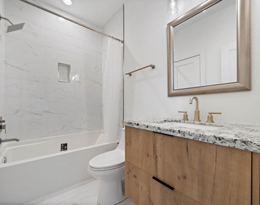 207 E 38th Street E - Photo Thumbnail 6
