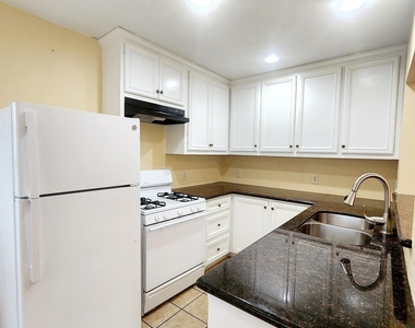 725 E 10th 1/2 Street - Photo Thumbnail 2