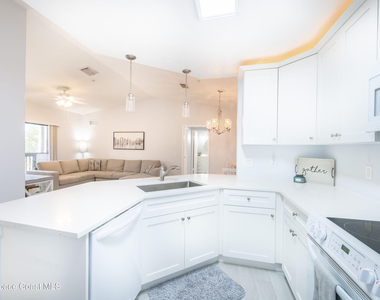 7667 N Wickham Road - Photo Thumbnail 2