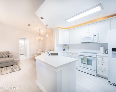 7667 N Wickham Road - Photo Thumbnail 1
