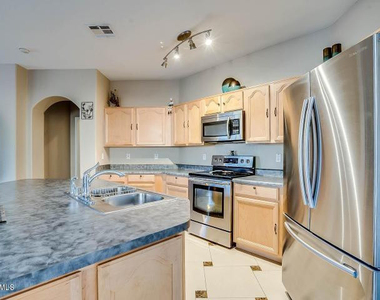 14833 W Charter Oak Road - Photo Thumbnail 3