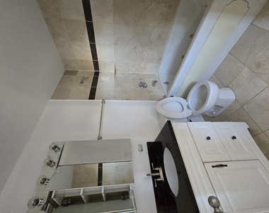 1711 W Jarvis Avenue - Photo Thumbnail 6