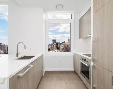 E 23rd St - Photo Thumbnail 3