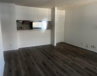 5981 Arapaho Road - Photo Thumbnail 3