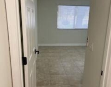 5011 Wiles Road - Photo Thumbnail 4
