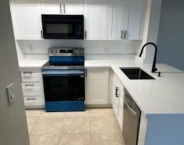 5011 Wiles Road - Photo Thumbnail 2