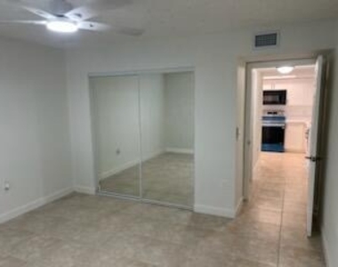 5011 Wiles Road - Photo Thumbnail 3