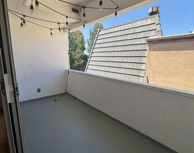 8710 Delgany Ave - Photo Thumbnail 4