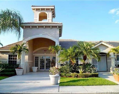 5005 Wiles Road - Photo Thumbnail 1